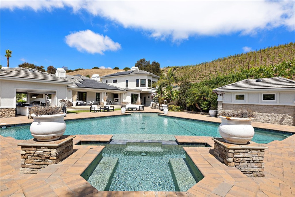 3202 Portico Del Norte San Clemente, CA 92673 - Photo 52 of 62 a front view of a house with swimming pool yard and outdoor seating