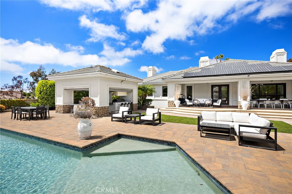 3202 Portico Del Norte San Clemente, CA 92673 - Photo 55 of 62 a view of a patio with couches table and chairs and potted plants