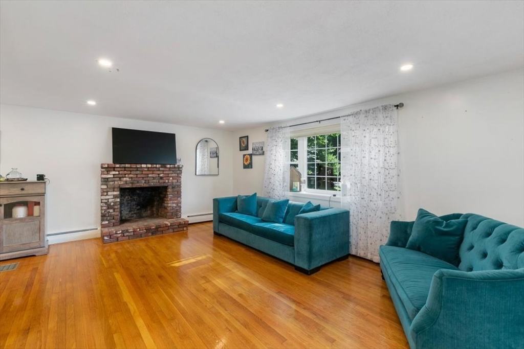 11 Harriman Road Merrimac, MA 01860 - Photo 7 of 31 a living room with furniture and a fireplace