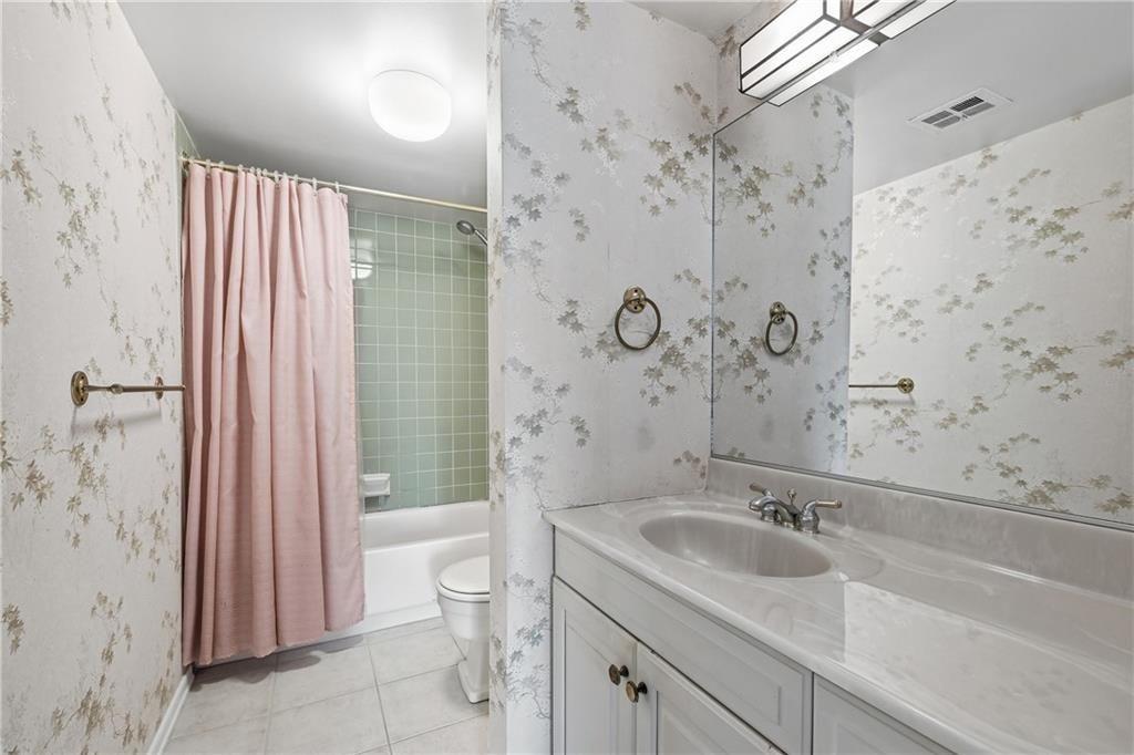 2160 Greentree Road, Unit 705W Pittsburgh, PA 15220 - Photo 22 of 32 a bathroom with a sink toilet double vanity and shower