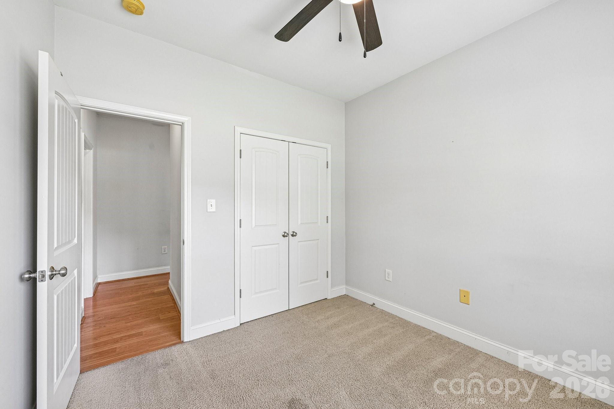 624 Hunley Street Monroe, NC 28112 - Photo 22 of 36 an empty room with closet and windows