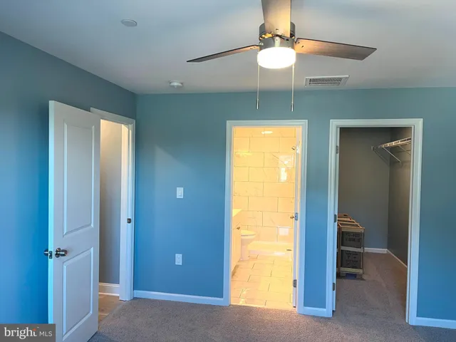 a view of an empty room with a bathroom