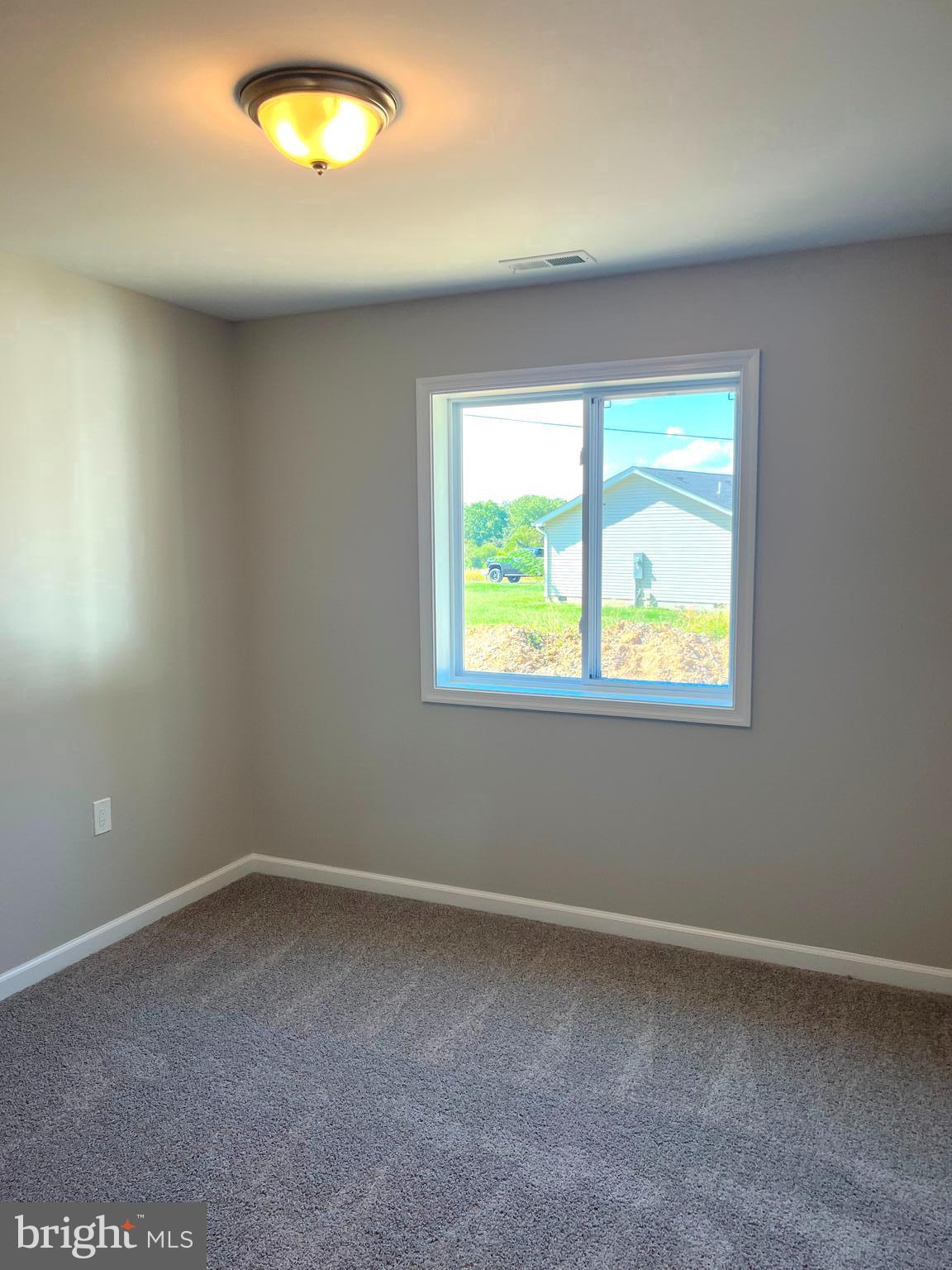 0 Will Be 11037 Bottom Road Worton, MD 21678 - Photo 16 of 32 an empty room with a window