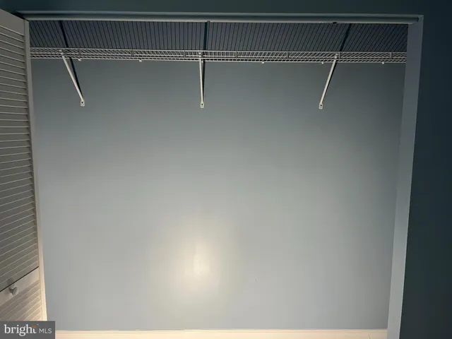 a bathroom with a double vanity sink toilet and a mirror