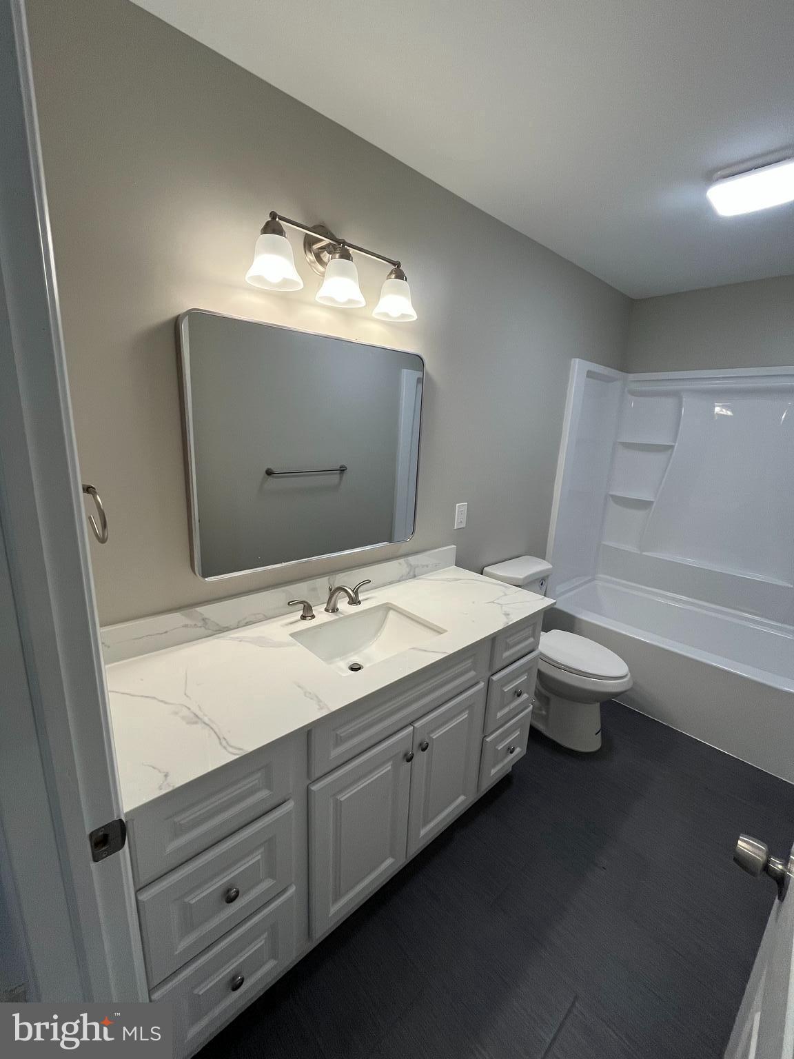 0 Will Be 11037 Bottom Road Worton, MD 21678 - Photo 21 of 32 a bathroom with a double vanity sink toilet and a mirror