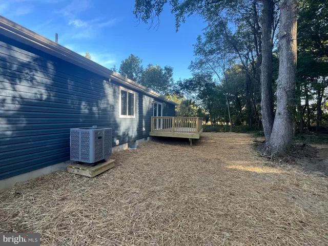 a view of a backyard with a small cabin