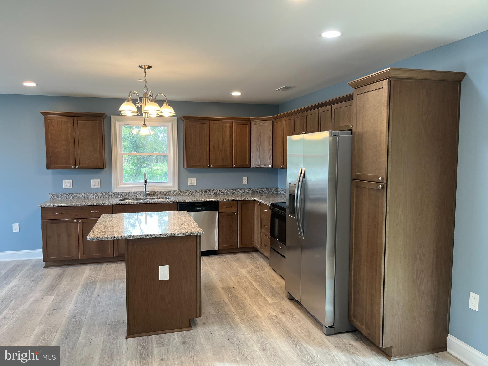0 Will Be 11037 Bottom Road Worton, MD 21678 - Photo 6 of 32 a kitchen with stainless steel appliances granite countertop a refrigerator a sink a stove a counter space and cabinets