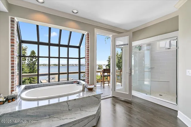 a bathroom with a bathtub and a window