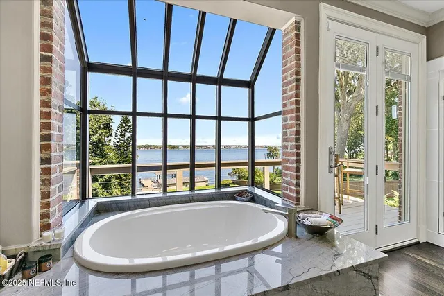 a view of a chairs and table in patio
