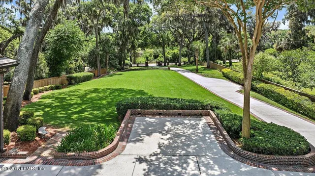 a view of a garden with a patio