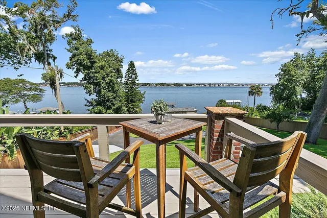 a view of a garden with a lake view