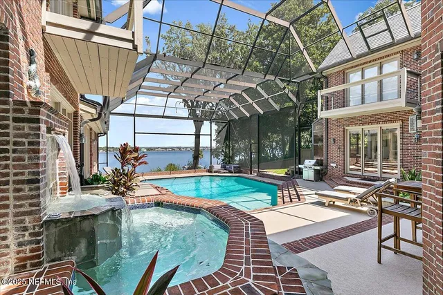 a view of a backyard with plants and patio
