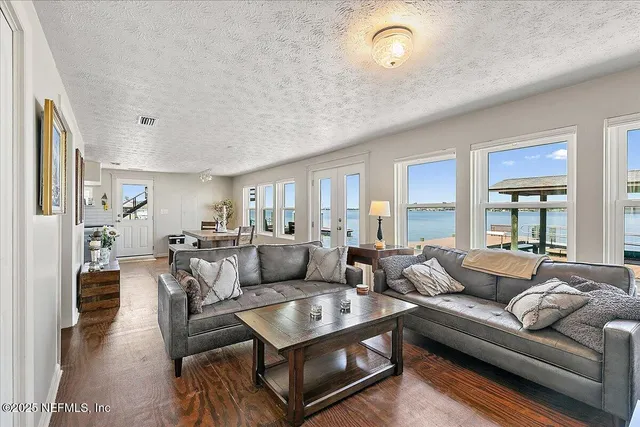 a view of balcony with chairs and wooden floor