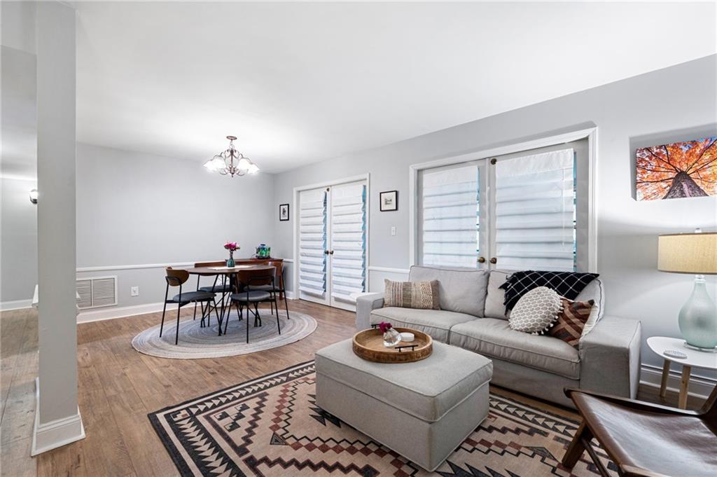 83 La Rue Place Northwest Atlanta, GA 30327 - Photo 1 of 1 a living room with furniture and a table