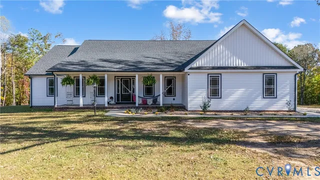 a view of a house with a swimming pool and a yard