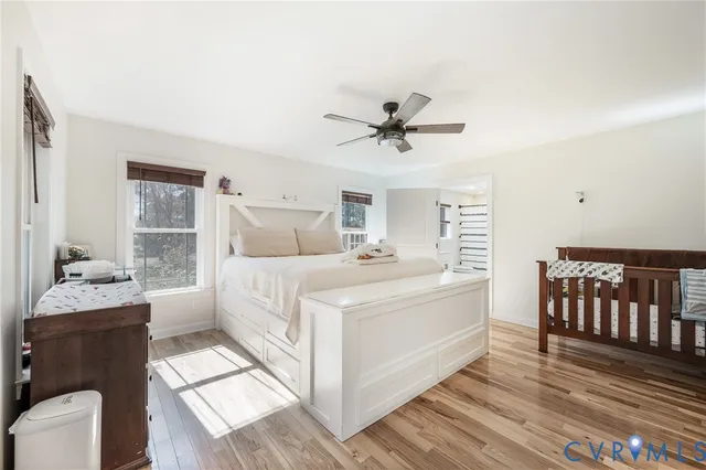 a large white bed in a white room