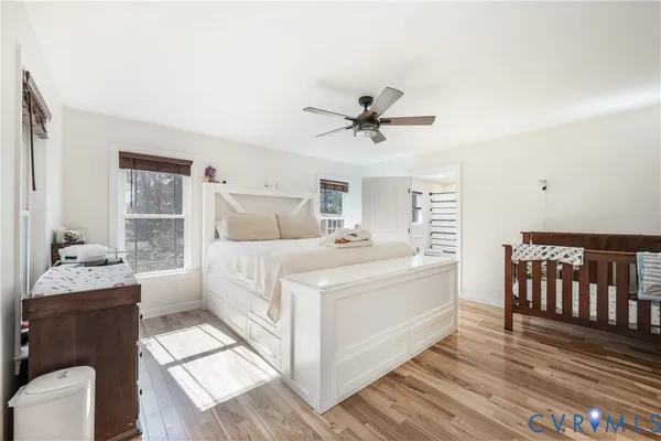 a large white bed in a white room