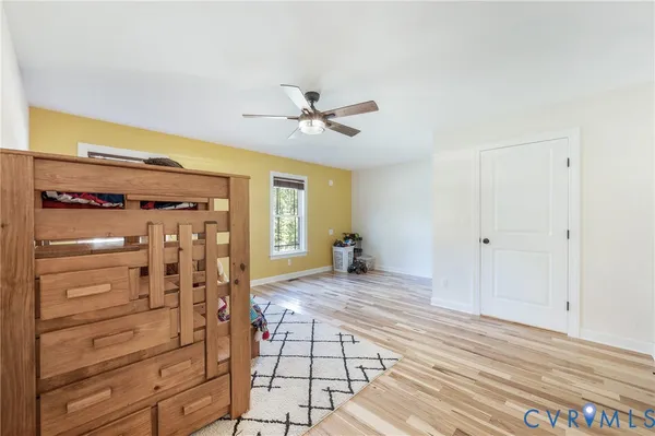 a view of a bedroom with closet and cabinet