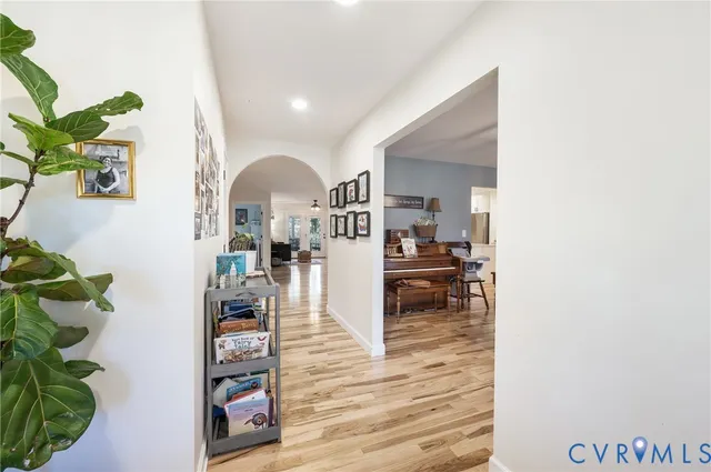a view of living room with furniture and a potted plant