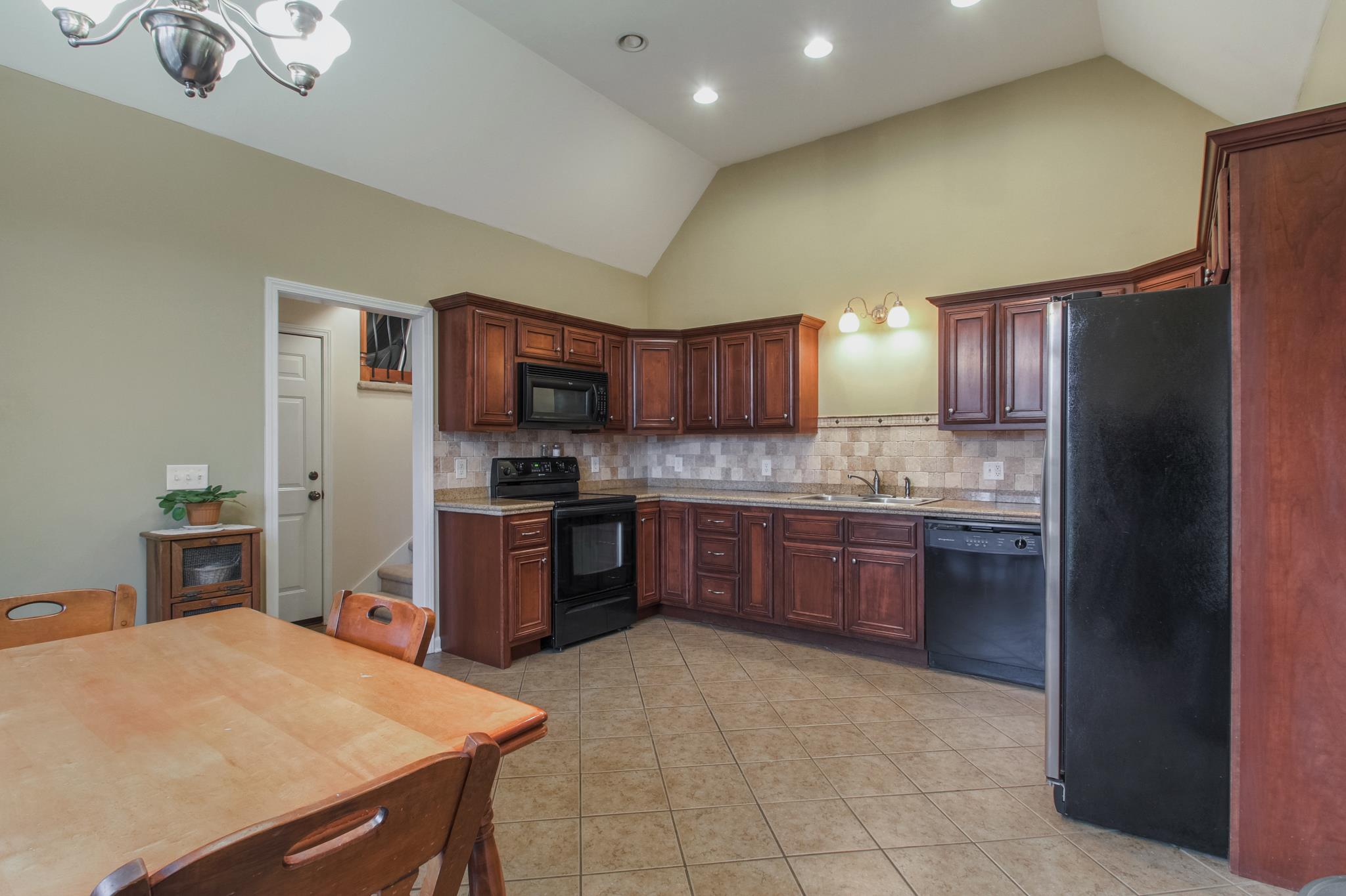 2735 Derby Run Road Springfield, TN 37172 - Photo 4 of 25 a kitchen with stainless steel appliances granite countertop a refrigerator stove top oven a sink and dishwasher