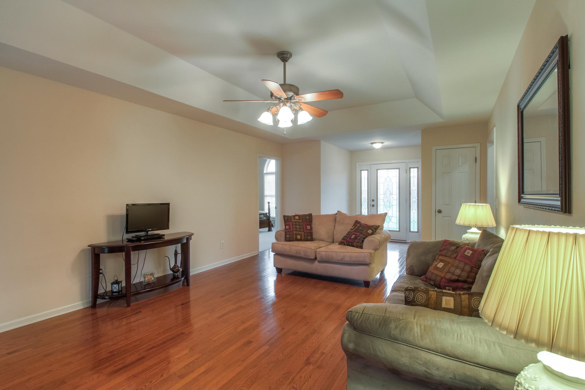2735 Derby Run Road Springfield, TN 37172 - Photo 9 of 25 a living room with furniture chandelier and a flat screen tv