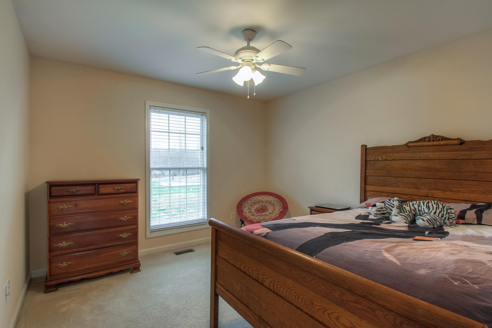 2735 Derby Run Road Springfield, TN 37172 - Photo 10 of 25 a bedroom with a bed and a chandelier