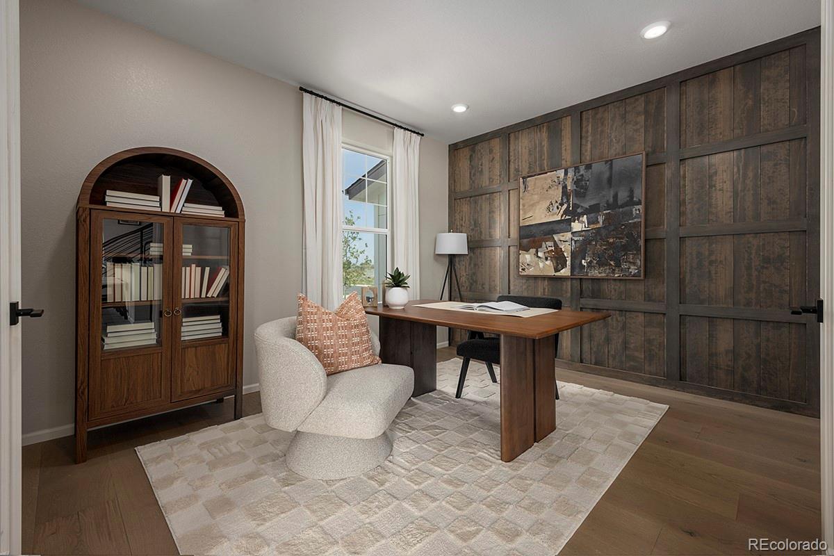 1717 Bloom Street Brighton, CO 80601 - Photo 8 of 11 a living room with furniture and a window