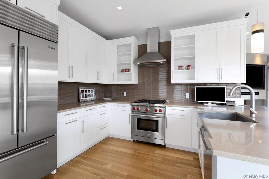 18 Rivers Edge Drive, Unit 211 Tarrytown, NY 10591 - Photo 10 of 30 a kitchen with stainless steel appliances granite countertop a stove a sink and a refrigerator