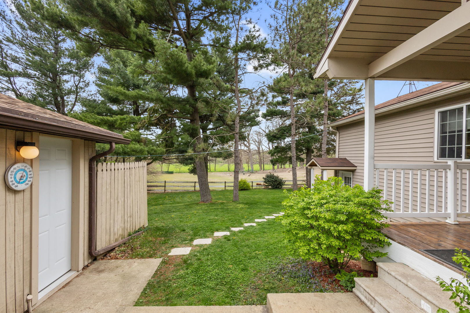 7134 North Bull Creek Road Grant Park, IL 60940 - Photo 13 of 46 a view of a backyard with plants and large tree