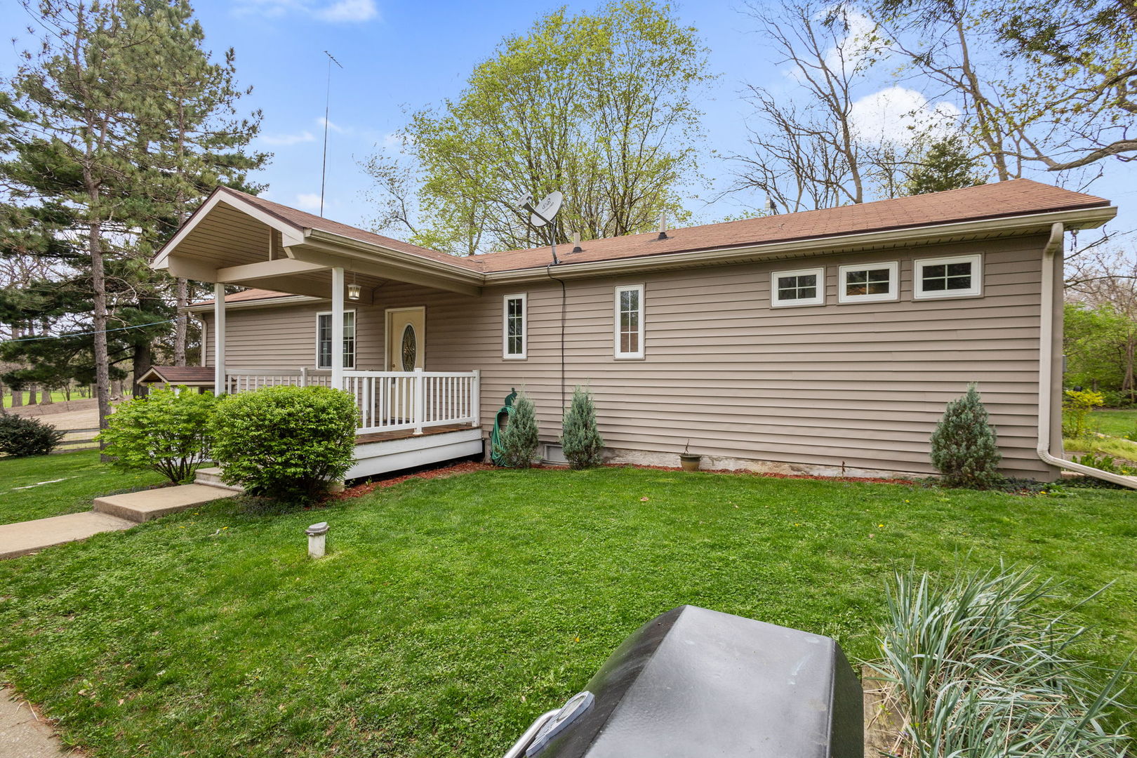 7134 North Bull Creek Road Grant Park, IL 60940 - Photo 2 of 46 a view of a house with a backyard