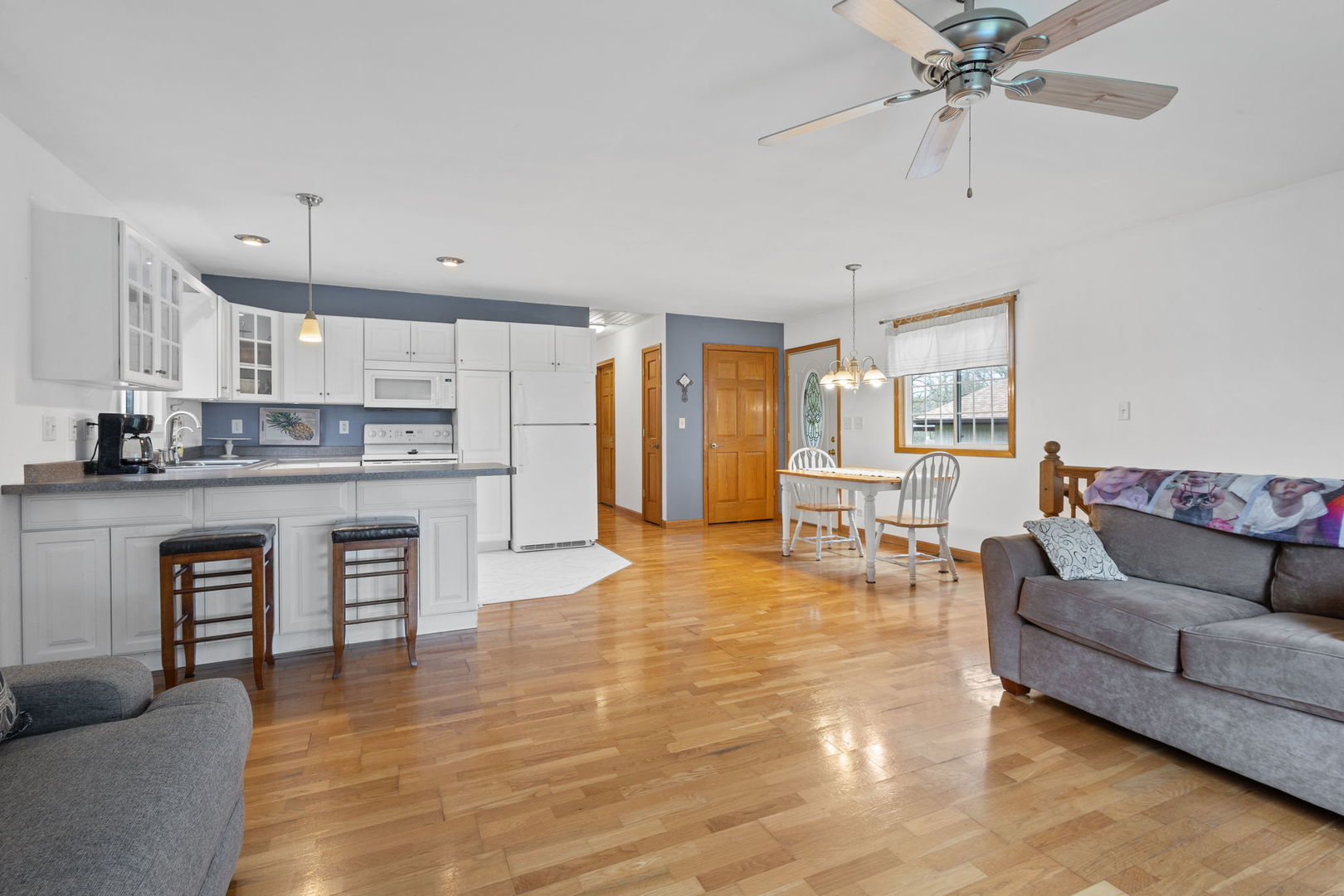 7134 North Bull Creek Road Grant Park, IL 60940 - Photo 23 of 46 a living room with stainless steel appliances furniture and a kitchen view