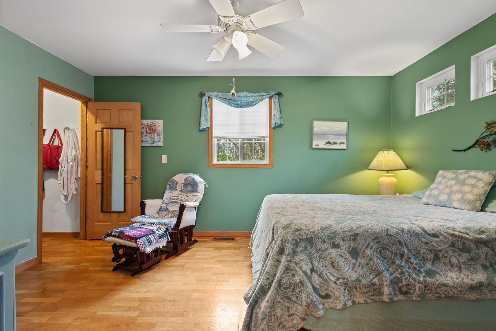 7134 North Bull Creek Road Grant Park, IL 60940 - Photo 29 of 46 a bedroom with a bed and a chandelier