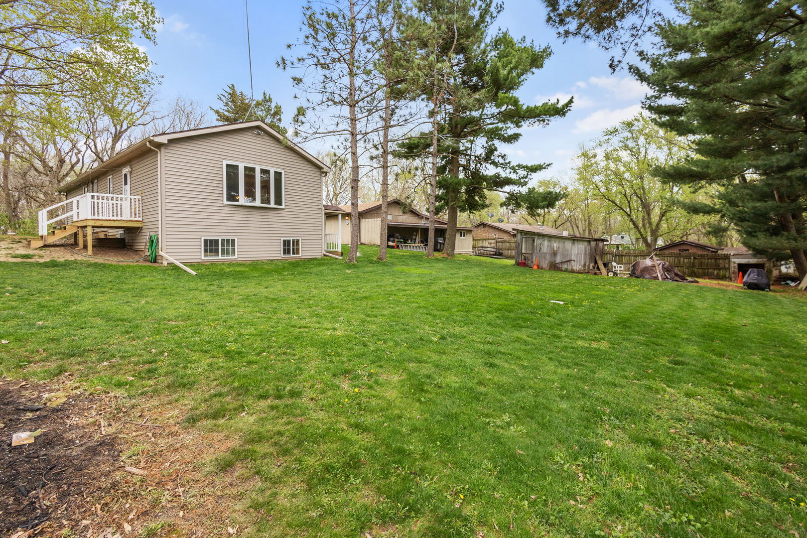 7134 North Bull Creek Road Grant Park, IL 60940 - Photo 5 of 46 a house that has a tree in front of it
