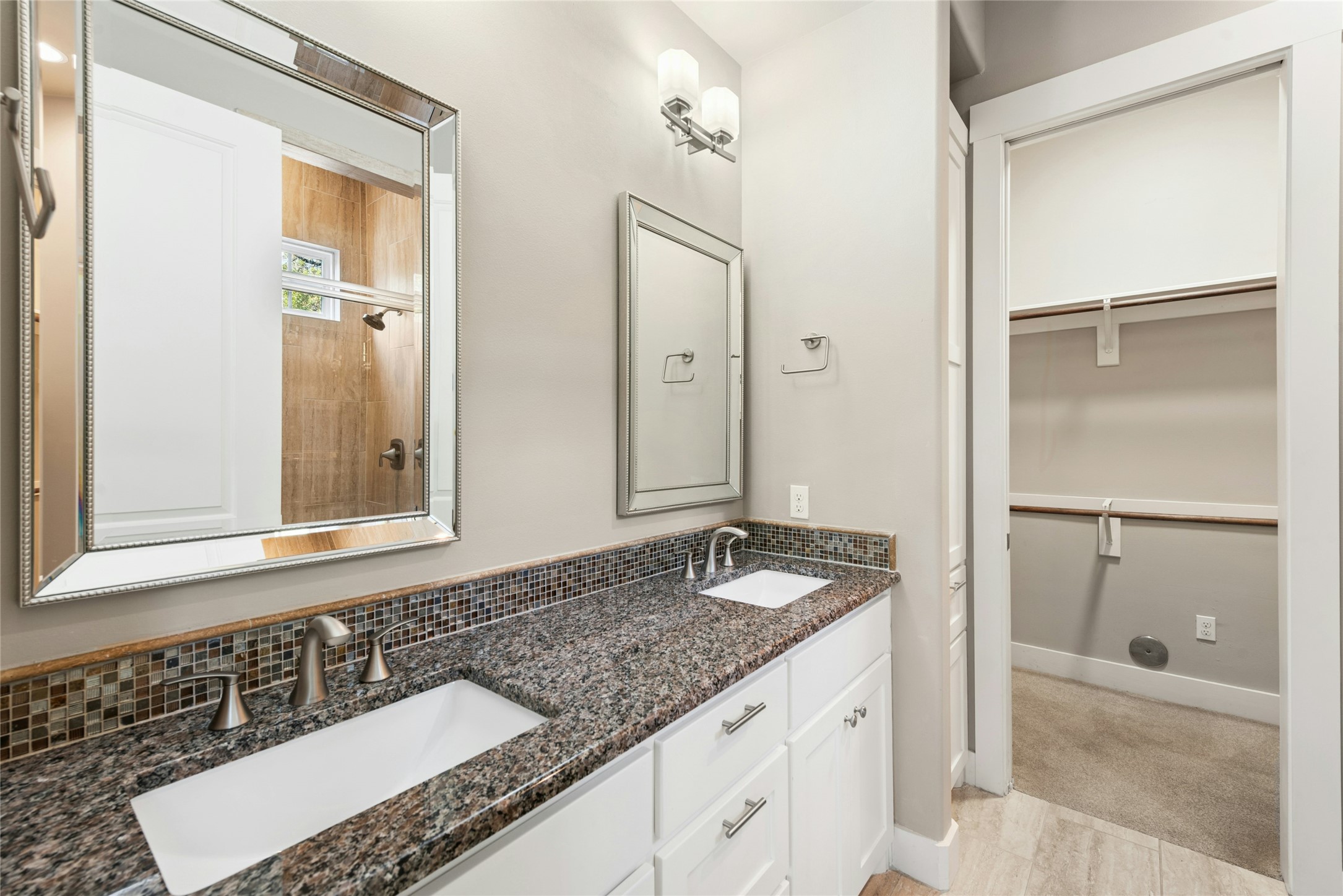 4301 Mansfield Dam Road, Unit 2101 Austin, TX 78734 - Photo 21 of 40 a bathroom with a granite countertop sink and a mirror
