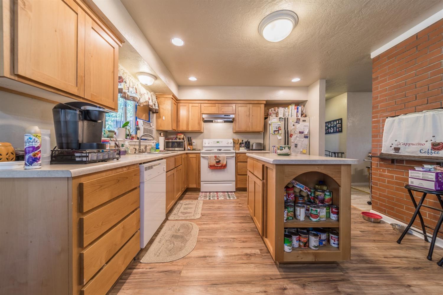 728 West Valley View Road Ashland, OR 97520 - Photo 25 of 32 a kitchen with stainless steel appliances a stove a sink and a refrigerator