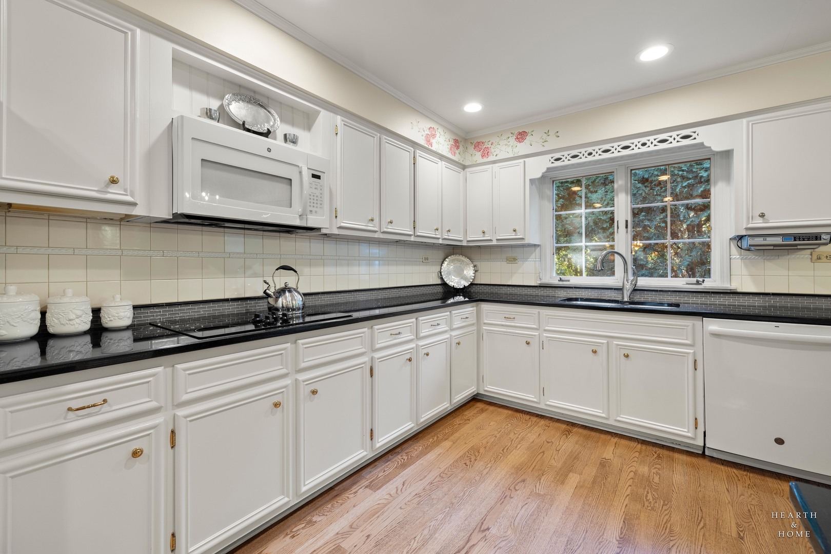 315 Old Mill Road Barrington, IL 60010 - Photo 15 of 37 a kitchen with granite countertop white cabinets white appliances and a wide window