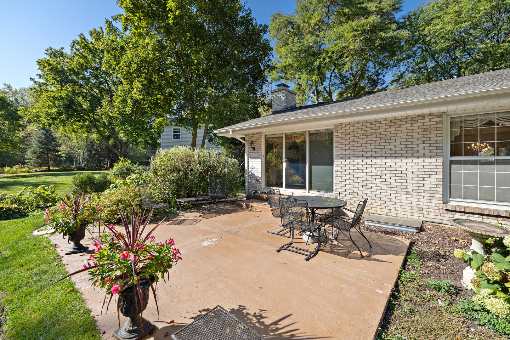 315 Old Mill Road Barrington, IL 60010 - Photo 32 of 37 a patio with table and chairs and potted plants
