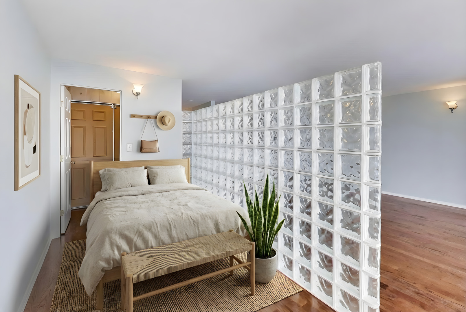 5415 North Sheridan Road, Unit 3203 Chicago, IL 60640 - Photo 5 of 20 a bedroom with a bed table and potted plant