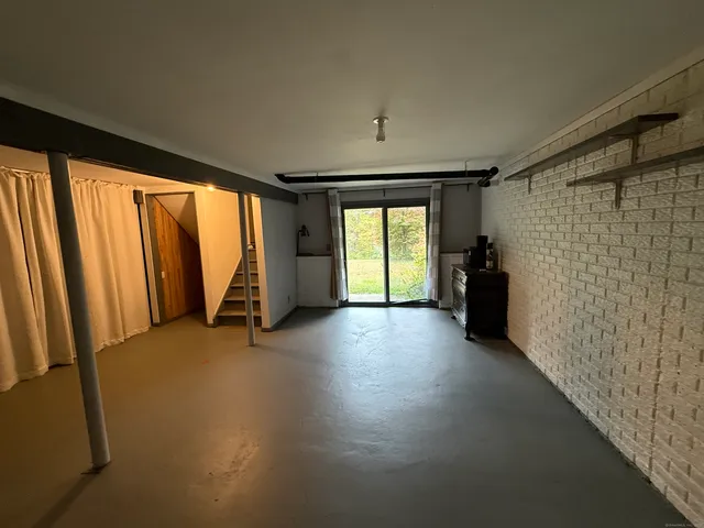 a view of empty room with floor to ceiling window