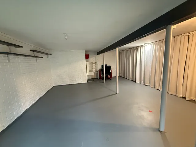 an empty room with windows