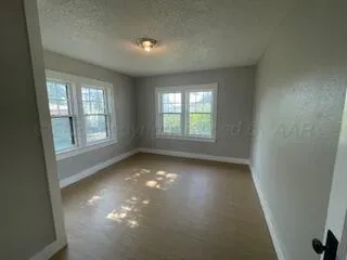 a bathroom with a sink and mirror with toilet