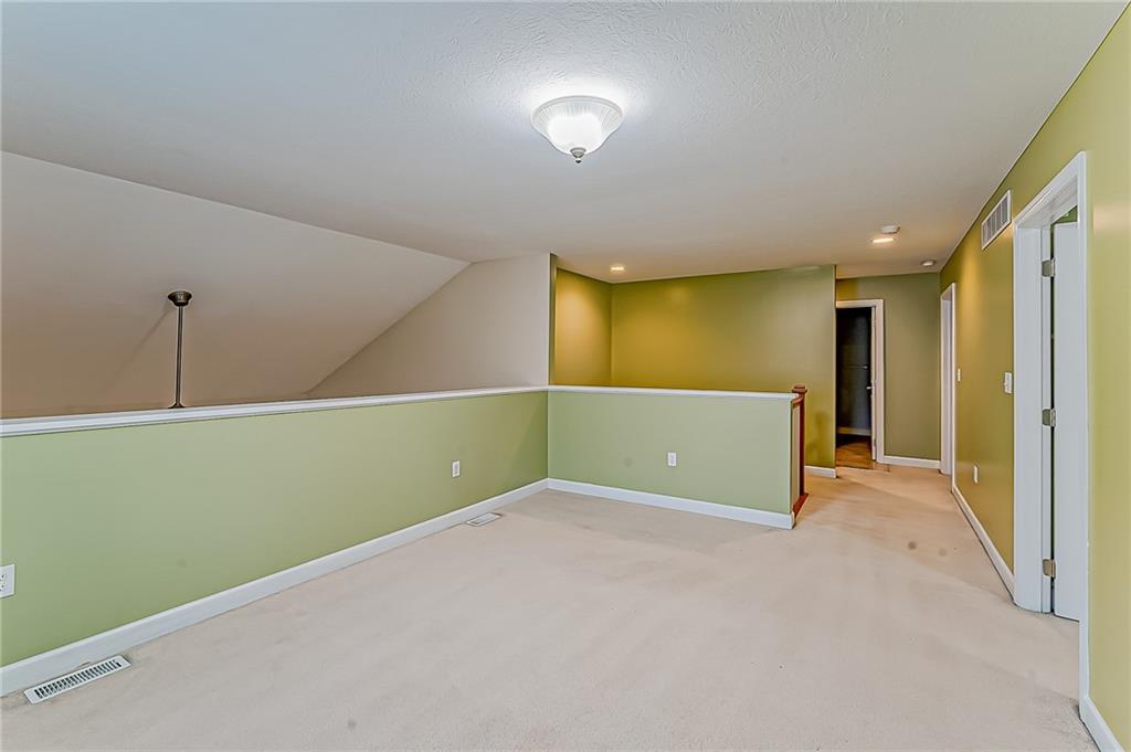 230 Berkeley Way, Unit B Monroeville, PA 15146 - Photo 23 of 25 a view of an empty room with window and stairs