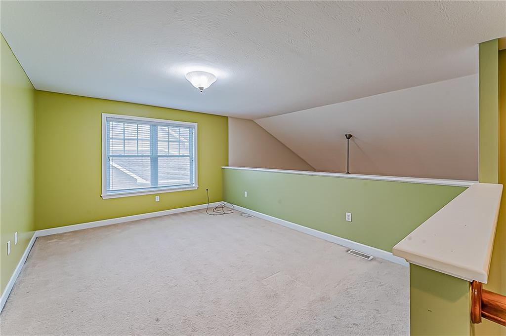 230 Berkeley Way, Unit B Monroeville, PA 15146 - Photo 24 of 25 a view of an empty room with a window and a projector