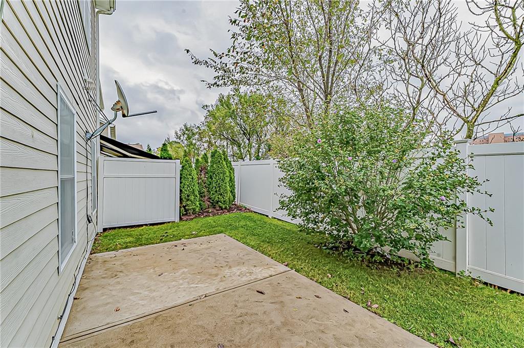 230 Berkeley Way, Unit B Monroeville, PA 15146 - Photo 25 of 25 a backyard of a house with plants and trees