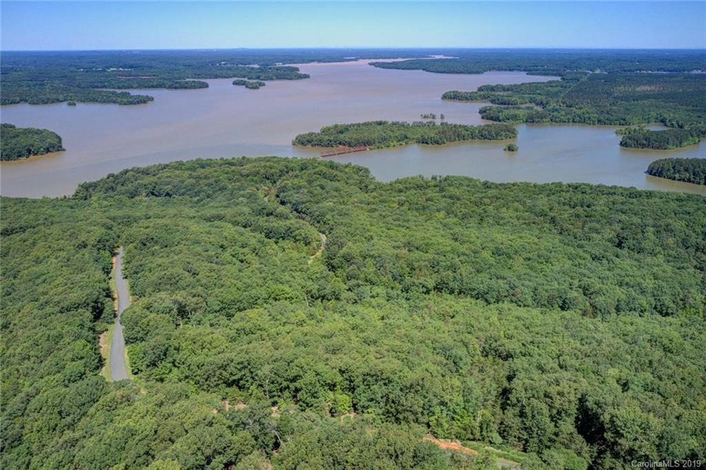285 Sierra Trace Road Denton, NC 27239 - Photo 1 of 26 a view of a lake with a city