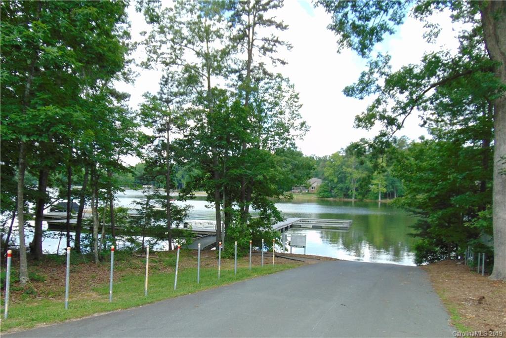 285 Sierra Trace Road Denton, NC 27239 - Photo 14 of 26 a lake view with a garden