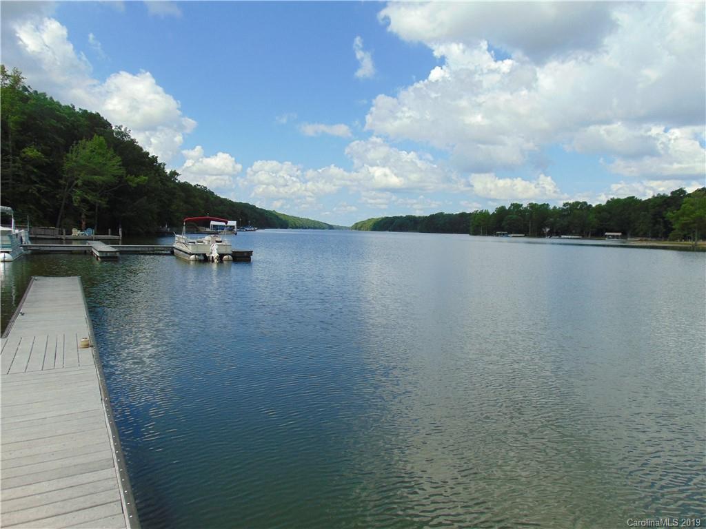 285 Sierra Trace Road Denton, NC 27239 - Photo 15 of 26 a view of a lake with houses in back