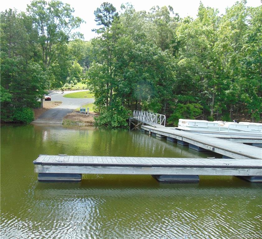 285 Sierra Trace Road Denton, NC 27239 - Photo 16 of 26 a view of a lake with a house