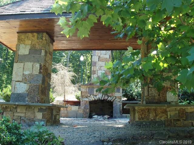 285 Sierra Trace Road Denton, NC 27239 - Photo 18 of 26 a view of a garden with a fountain
