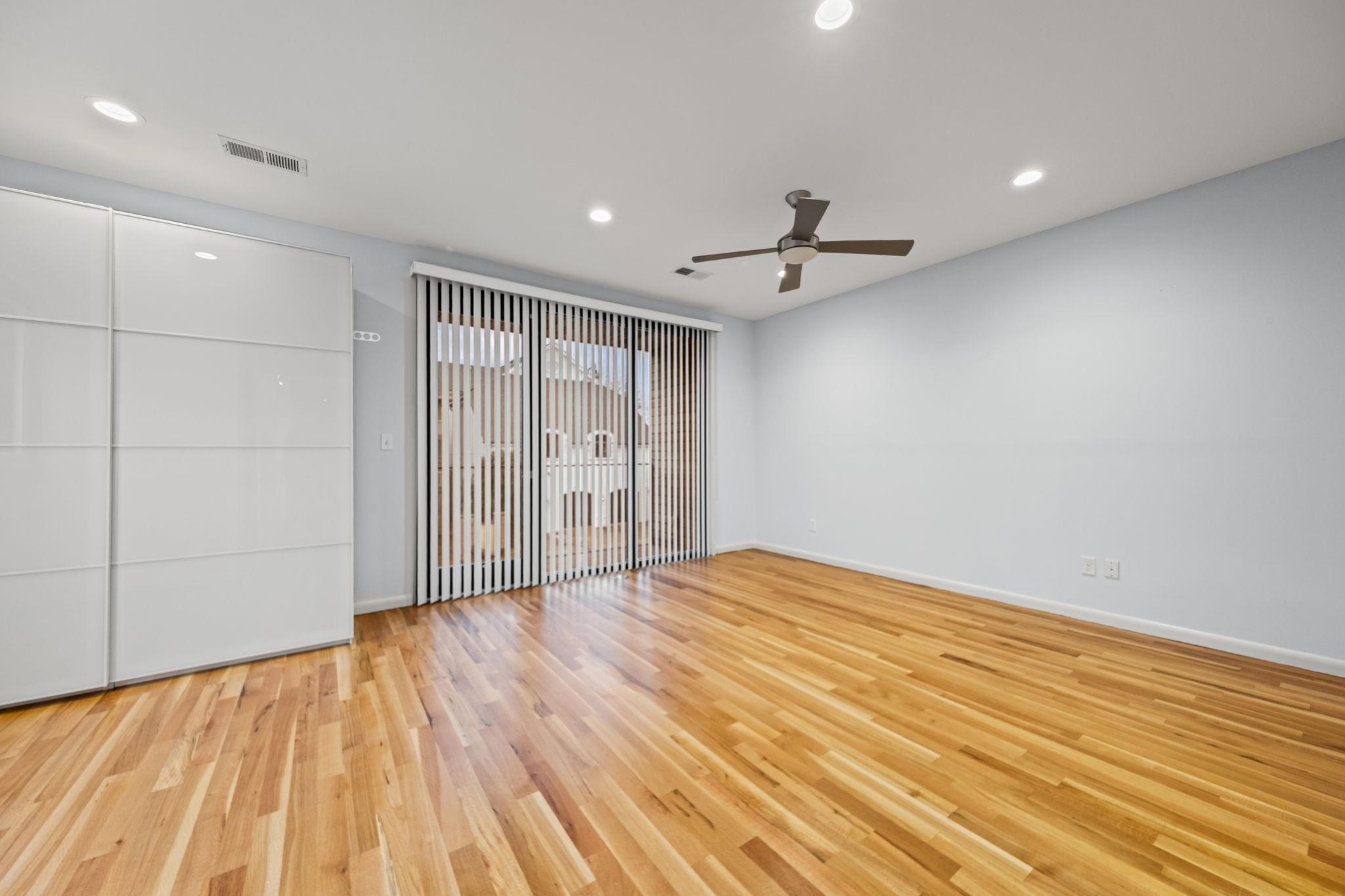448 Tennessee Street Memphis, TN 38103 - Photo 26 of 39 Hardwood flooring extending throughout, complemented by a contemporary ceiling fan